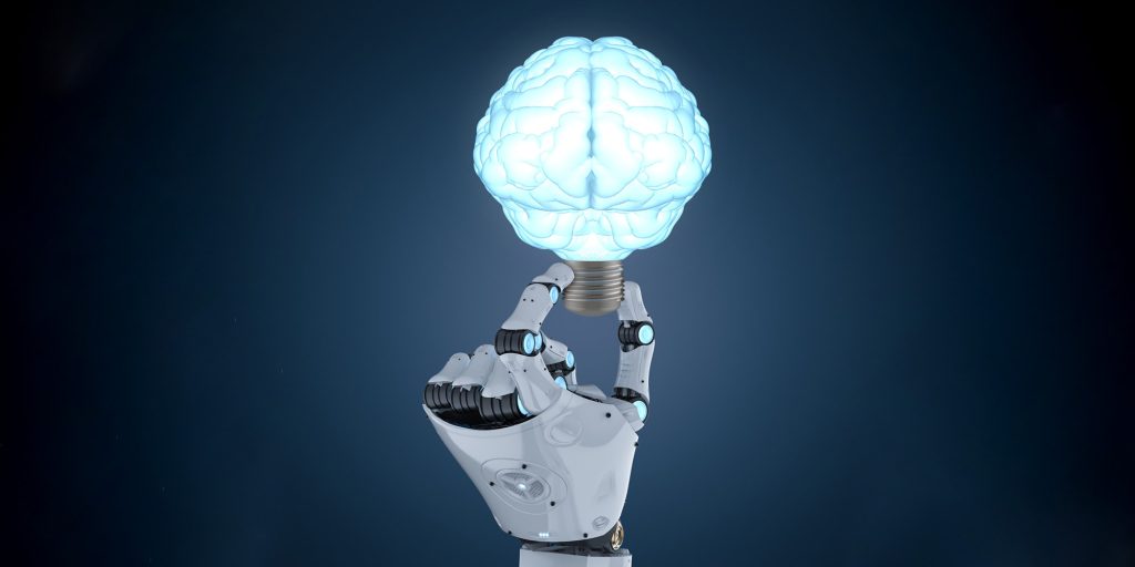 A robotic hand holding a glowing brain-shaped light bulb, symbolizing artificial intelligence and innovation.